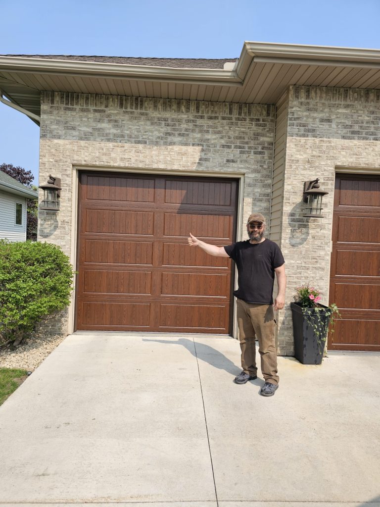 David Tuito giving thumbs up after garage door installation in Minneapolis Minnesota - real job photo