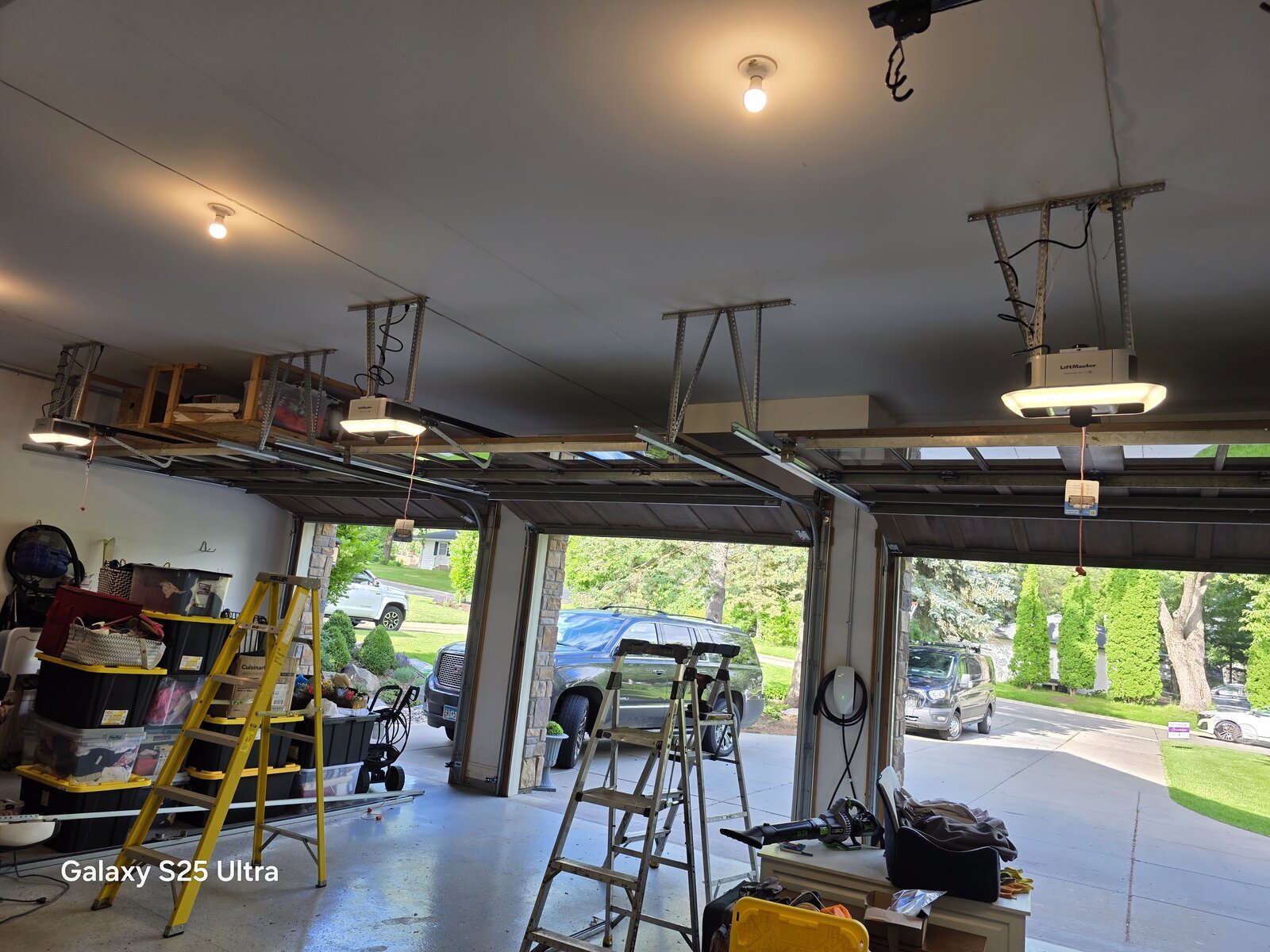 Three new LiftMaster myQ garage door openers installed in a Twin Cities home