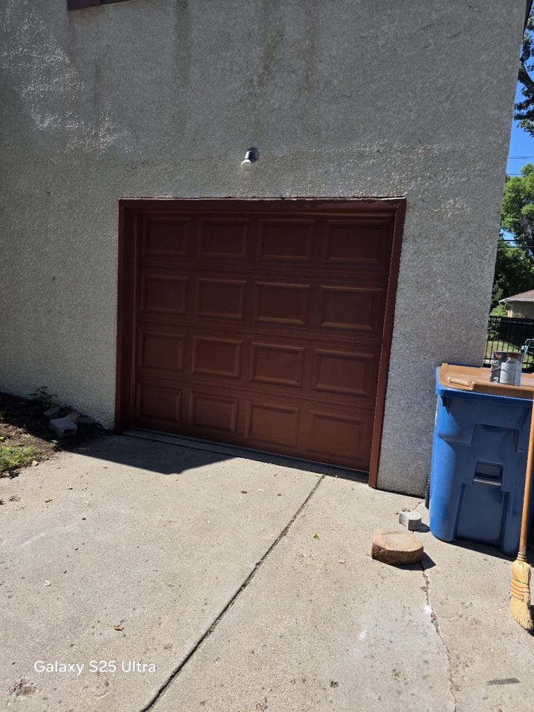 Brown steel garage door on a detached garage, Twin Cities MN