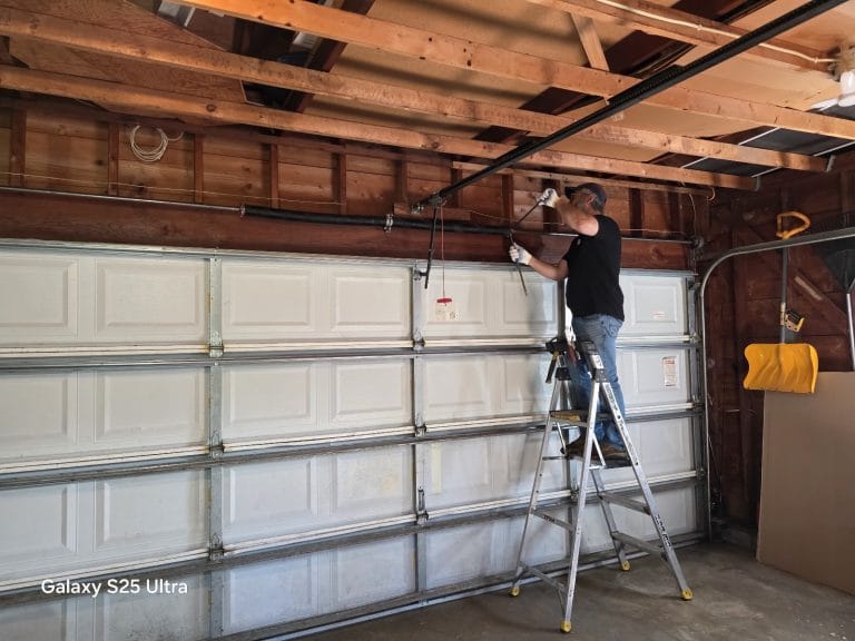 David Tuito installing a LiftMaster opener on a newly installed DoorLink garage door