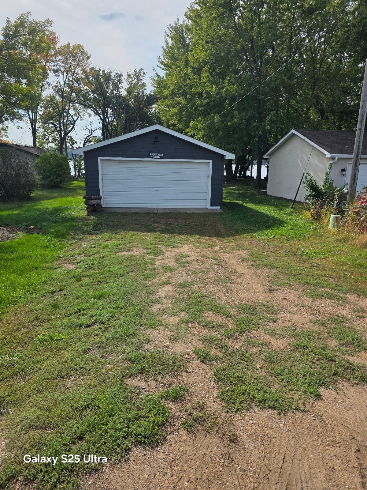 Detached garage with a white garage door on a service call in the Twin Cities, MN