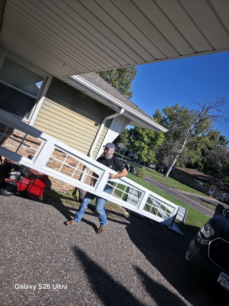 DoorLink top section with windows carried in for a new garage door installation
