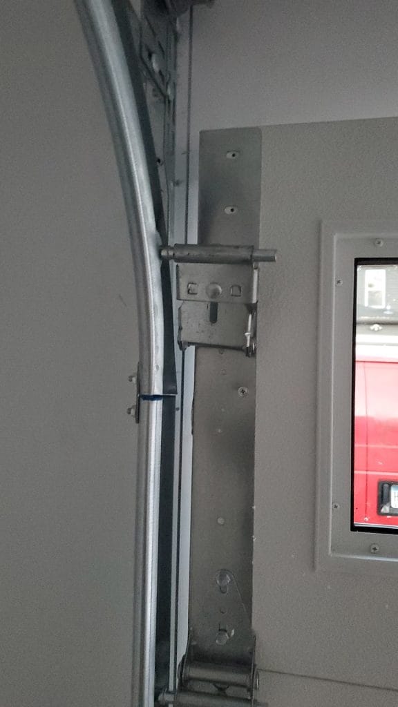 New garage door vertical track and jamb brackets after installation