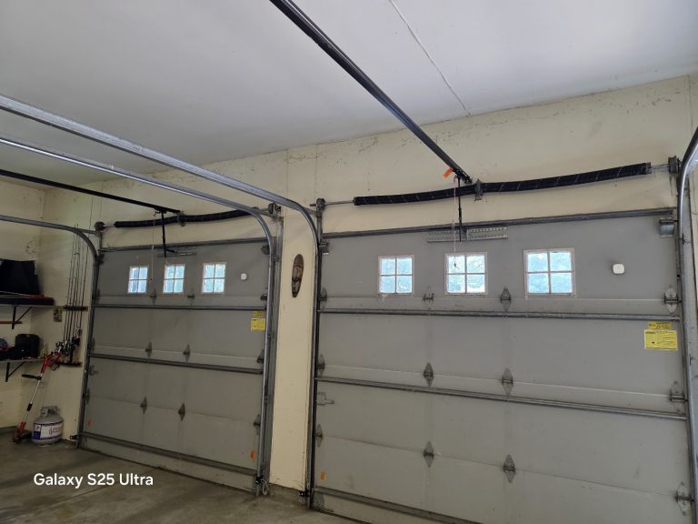 New white garage door with windows and a freshly installed opener, interior view, serving Fridley, MN