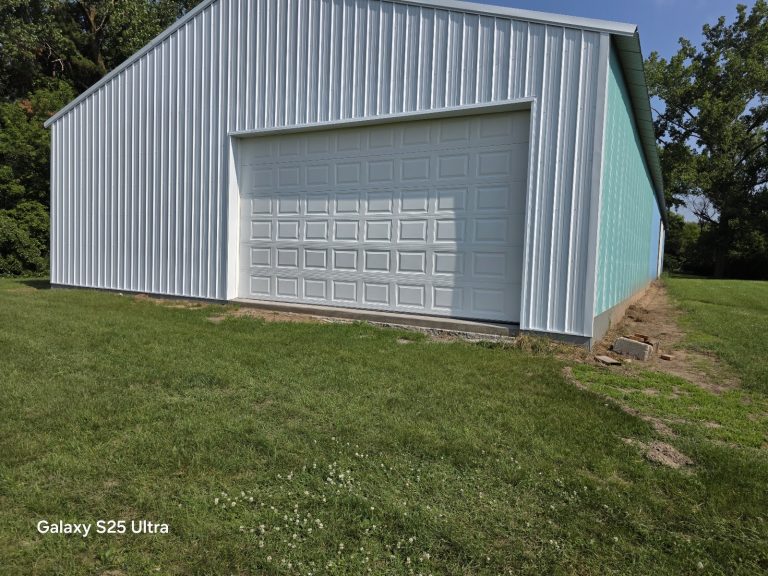 New white garage door installed on a metal outbuilding, serving Mounds View, MN