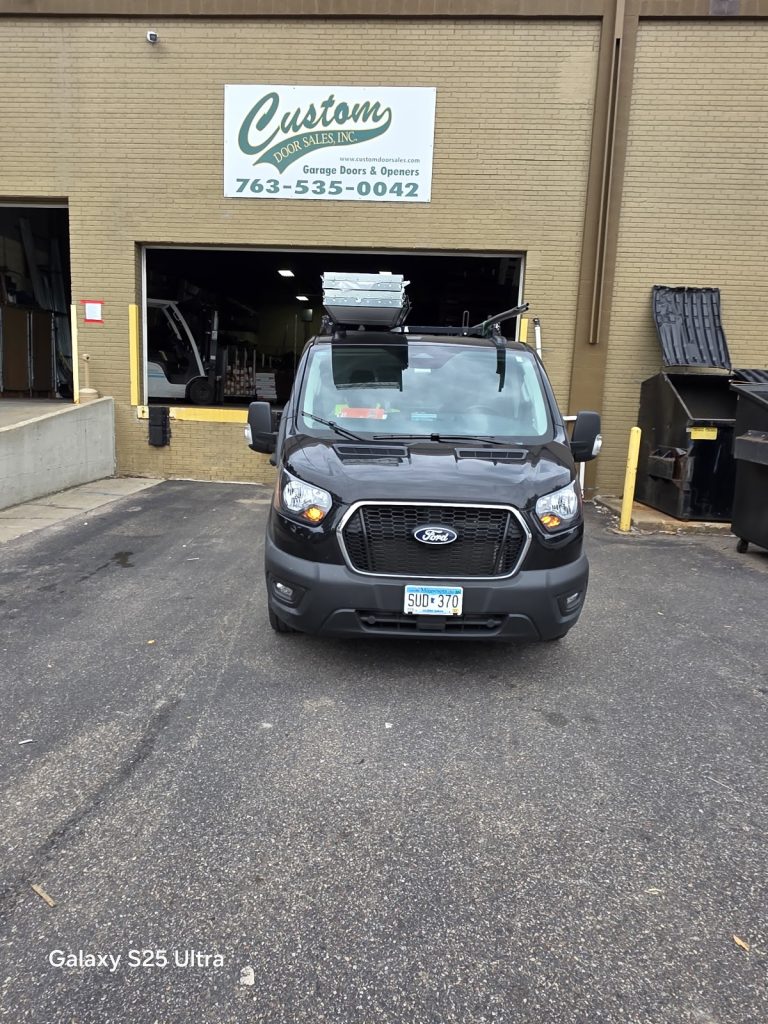 David's Urgent Garage Door service van at a job