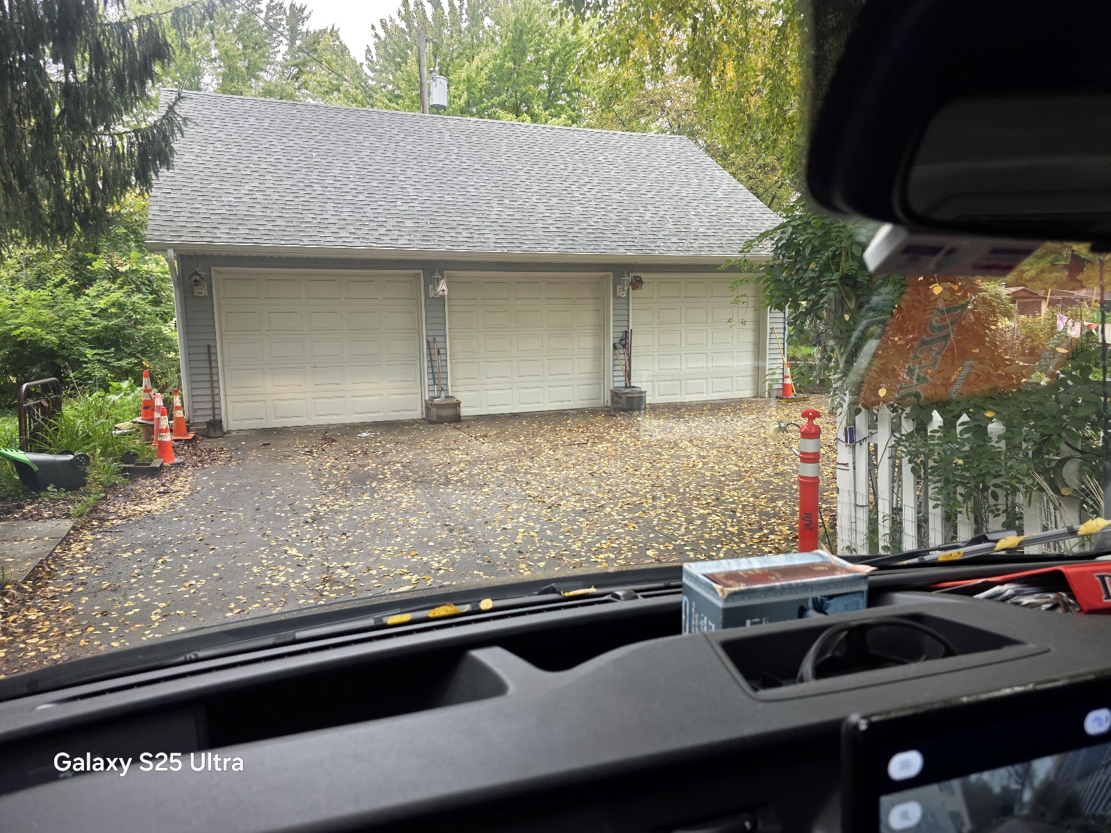 Detached two-door garage on a leafy fall driveway, west metro service call