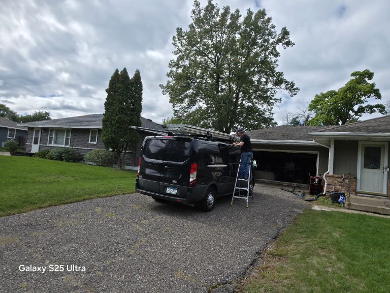 Garage door service van parked at a residential job in Minnesota