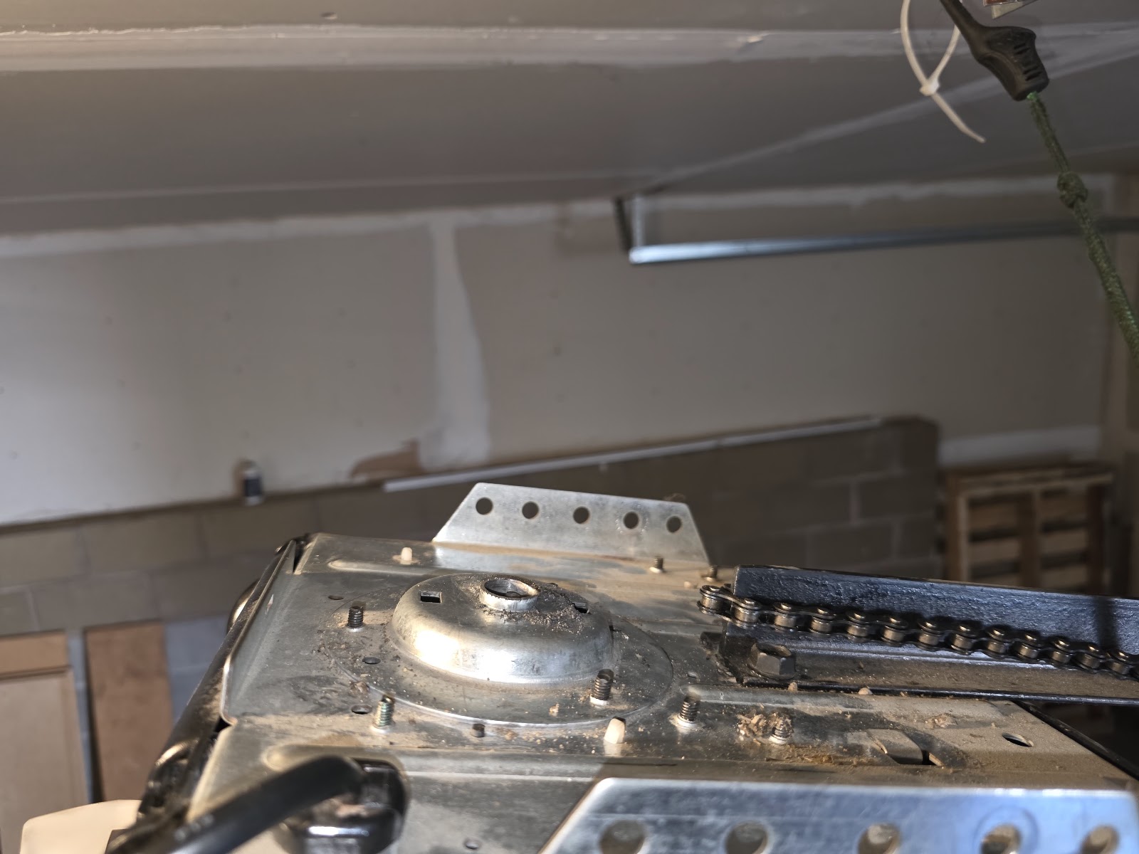 Close-up of a LiftMaster opener trolley and chain on the rail