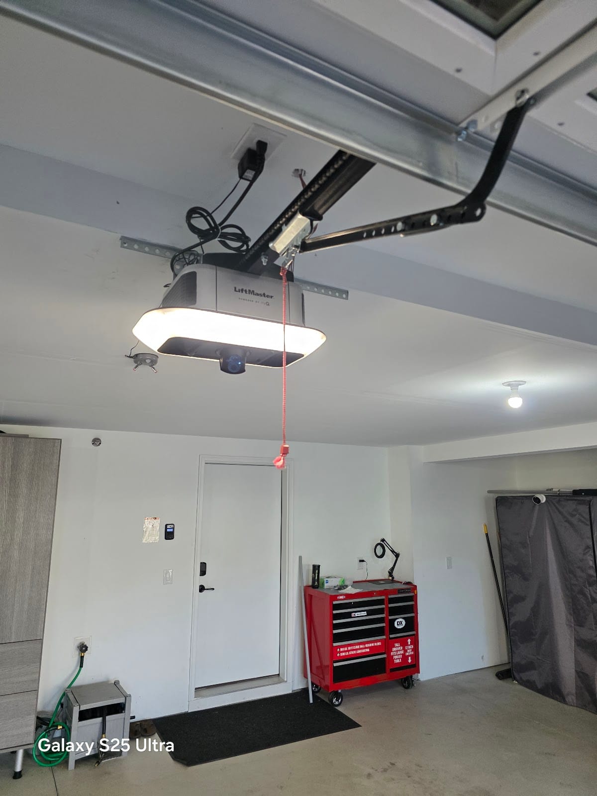 LiftMaster garage door opener with built-in LED light installed in a Twin Cities garage