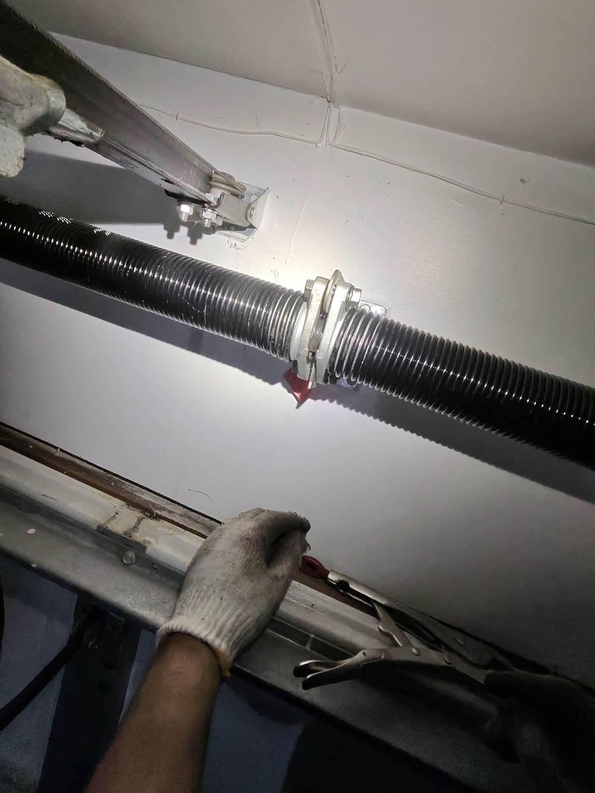 New torsion spring on the shaft after a spring replacement in Minnesota