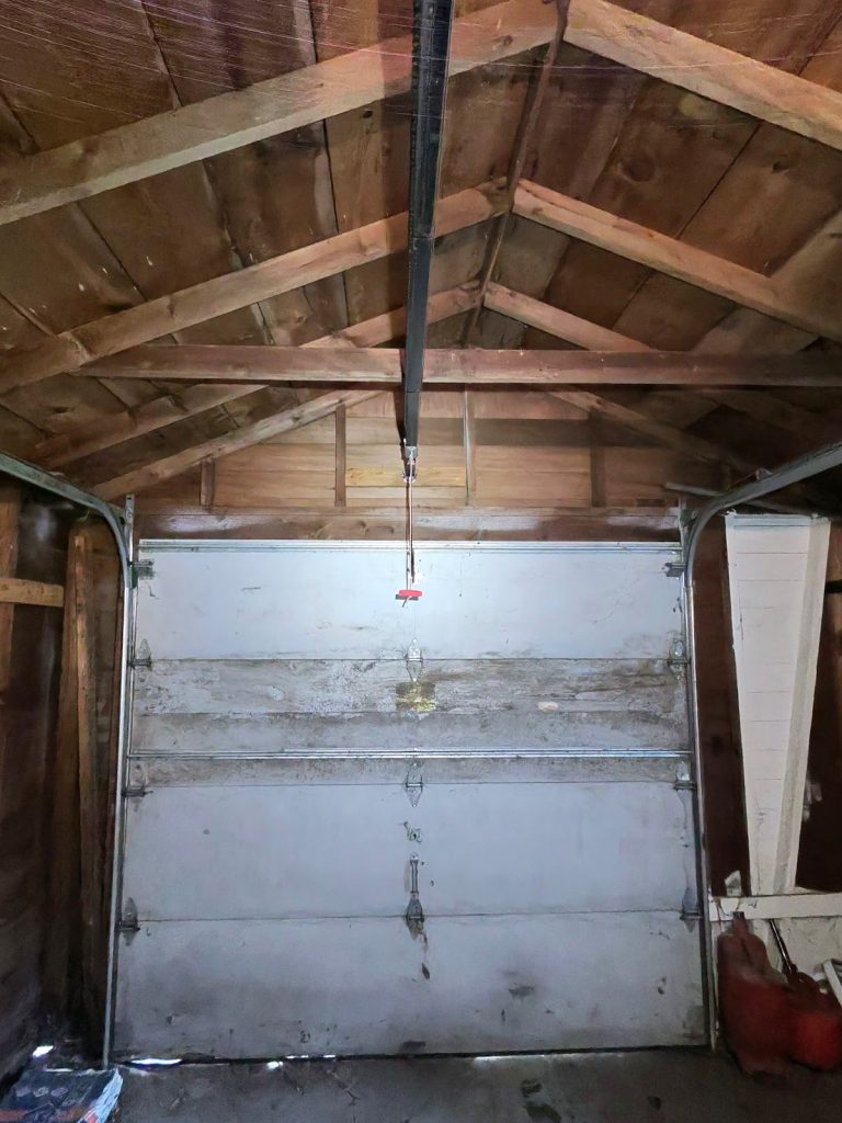 Old garage door before replacement, interior view