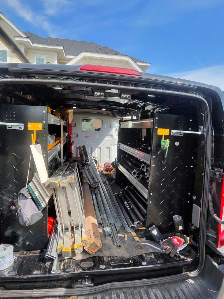 Service van stocked with garage door springs, rollers and parts