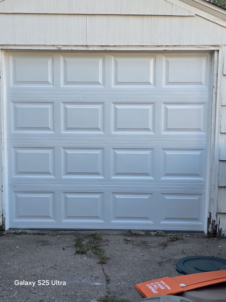 White raised-panel steel garage door, Minnesota