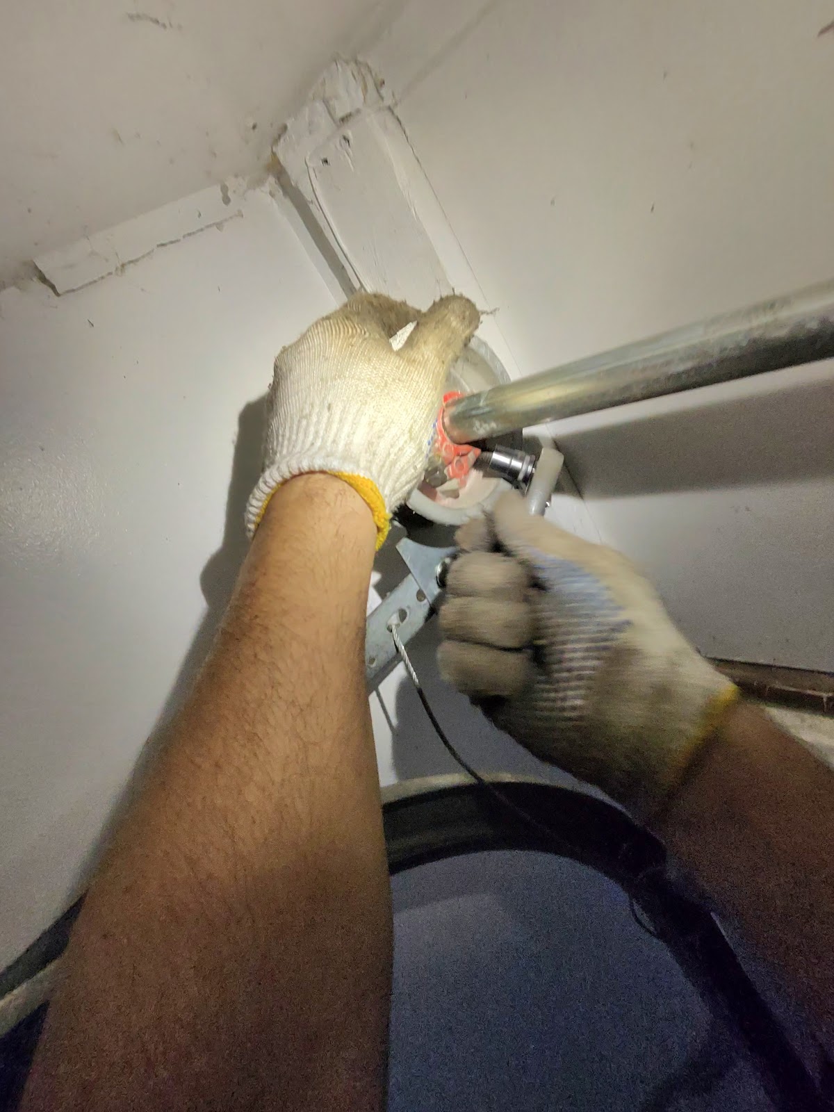 David winding a new torsion spring with winding bars - never a DIY job