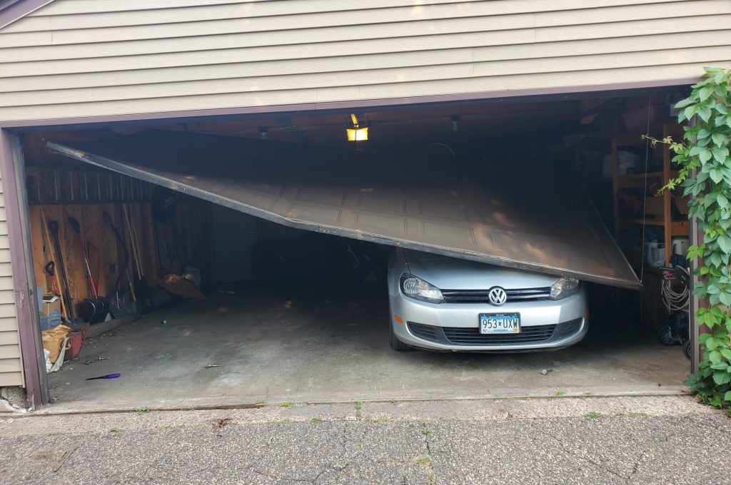Emergency garage door collapsed trapping car - David Urgent Garage Door emergency repair Minnesota